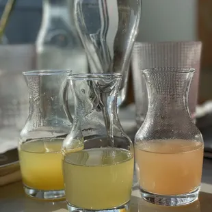 Smaller mimosa trio. Juices are orange, pineapple and peach.