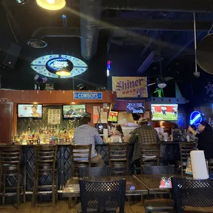 people sitting at a bar
