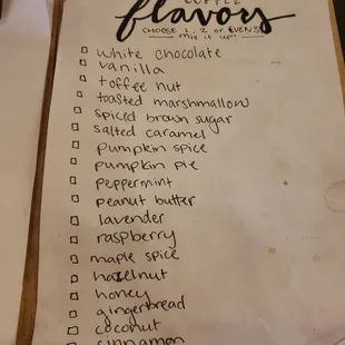 a list of flavors on a clipboard