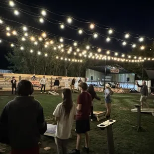 Corn hole and a stage in the back for live music