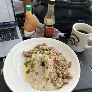 a plate of food and a laptop