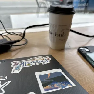 a cup of coffee and a laptop