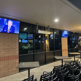 Outside tables even have TVs