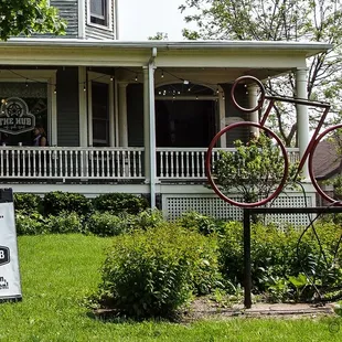 a bicycle on display in front of a house