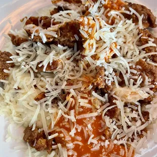 a plate of food with meat and cheese