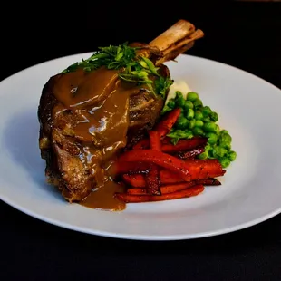 Braised Lamb Shank with glazed carrots, mash, peas and gravy