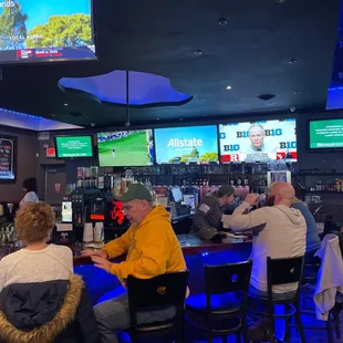 people sitting at the bar