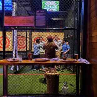 Photo of guys Axe Throwing for a Bachelor Party.  FYI...An employee will stay with groups during the renting of a booth.  9/10/2021
