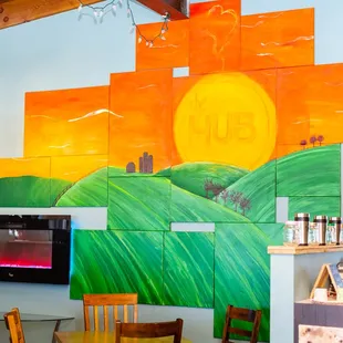 a mural of a sunset