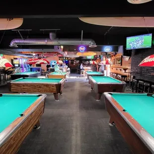 Pool hall. Smaller tables that are coin operated. $1 per game. I enjoyed it!