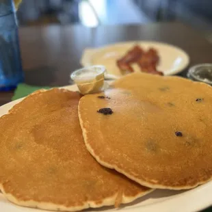 Blueberry pancakes added egg and bacon