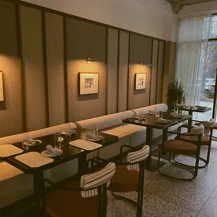 a restaurant with a long table and chairs