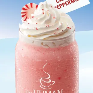 a strawberry milkshake with whipped cream