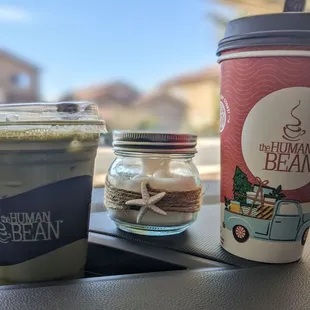 a cup of coffee and a jar of cookies