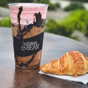 White Chocolate Cold Brew with Chocolate Sauce, splash of Chocolate Milk and topped with Strawberry Cold Foam!