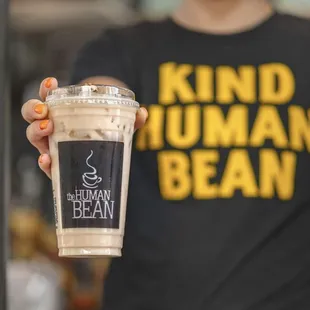 a person holding a cup of coffee