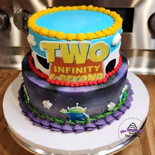 Two tiered Toy Story cake, galaxy and cow print