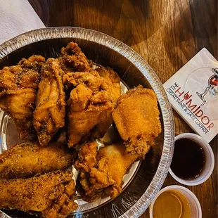 a bowl of fried chicken on a table
