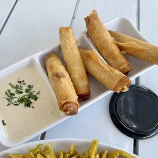 a plate of food and dipping sauce