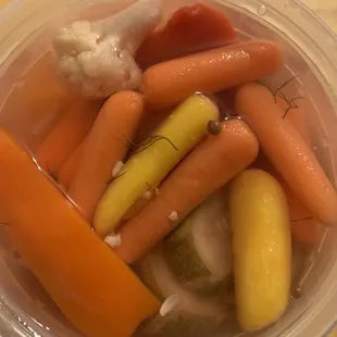 House pickles. Mostly carrots, some cukes and peppers and cauliflower. Crunchy and tasty.