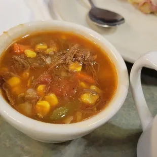 a bowl of soup and a plate of food