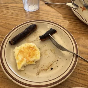 Over cooked egg and sausage