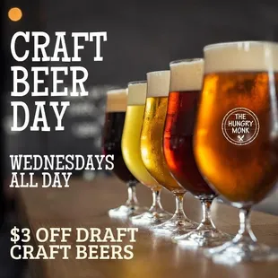 a row of beer glasses on a table