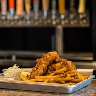 a plate of fried fish and fries