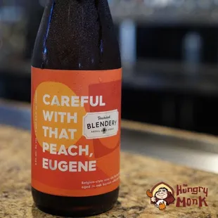 a bottle of beer sitting on a counter