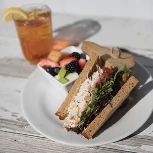 a sandwich and a bowl of fruit