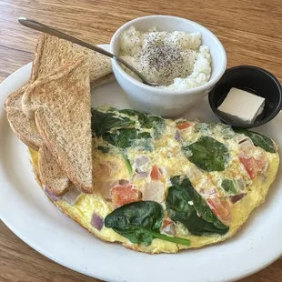 Smoked turkey veggie omelet with grits