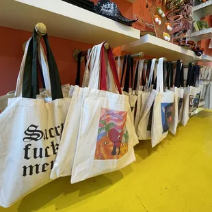 Souluna and yung hippy tote bags with motos and album covers