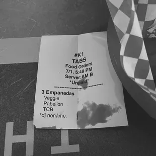 a checkered umbrella and a ticket