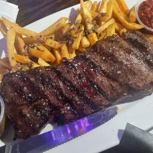 Steak with chimichurri (sauce on the left). Fries are served with salsa. Noyce!