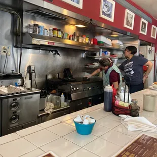 two people working in the kitchen