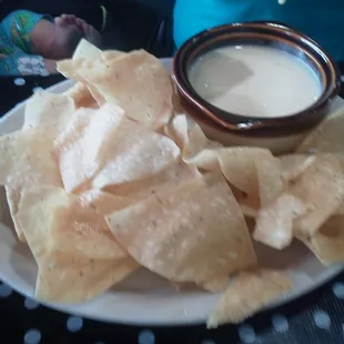 The chips are freshly made. Light, thin, and crispy. Mexican style cheese.