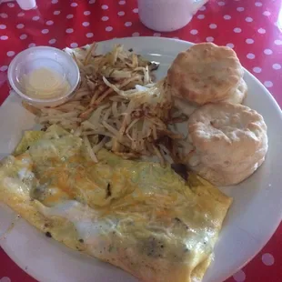 Sausage and cheddar omelet, hash browns and biscuits.