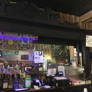a bar with neon signs