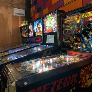 a row of pinball machines