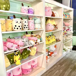 a shelf full of stuffed animals