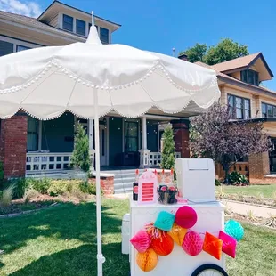 an ice cream cart in front of a house