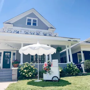an ice cart in front of a house