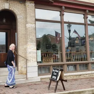 Easy to miss, the sign on the sidewalk is subtle and small