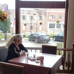 Lovely front dining area with large windows facing the street