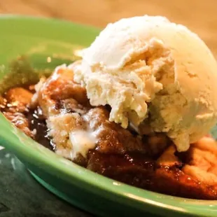 a bowl of dessert with a scoop of ice cream