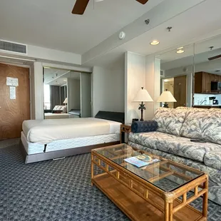 Image of the sleeping area with the Murphy bed deployed. (Notice the open bathroom door on the left.)