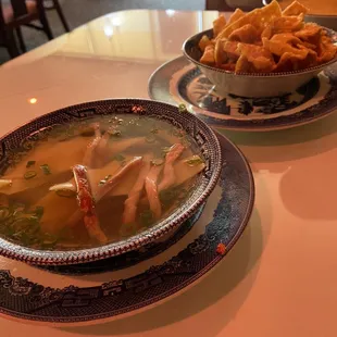 a bowl of soup and a bowl of chips