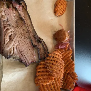 Plate with brisket and sweet potato fries