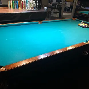 a pool table in a bar