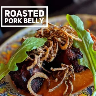 roasted pork belly on a plate